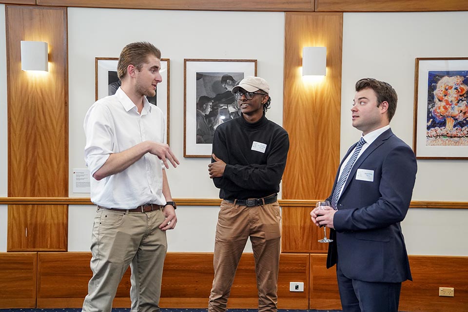 3 delegates having conversation